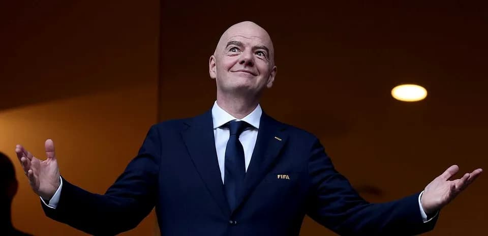 Man in suit gesturing during event or speech