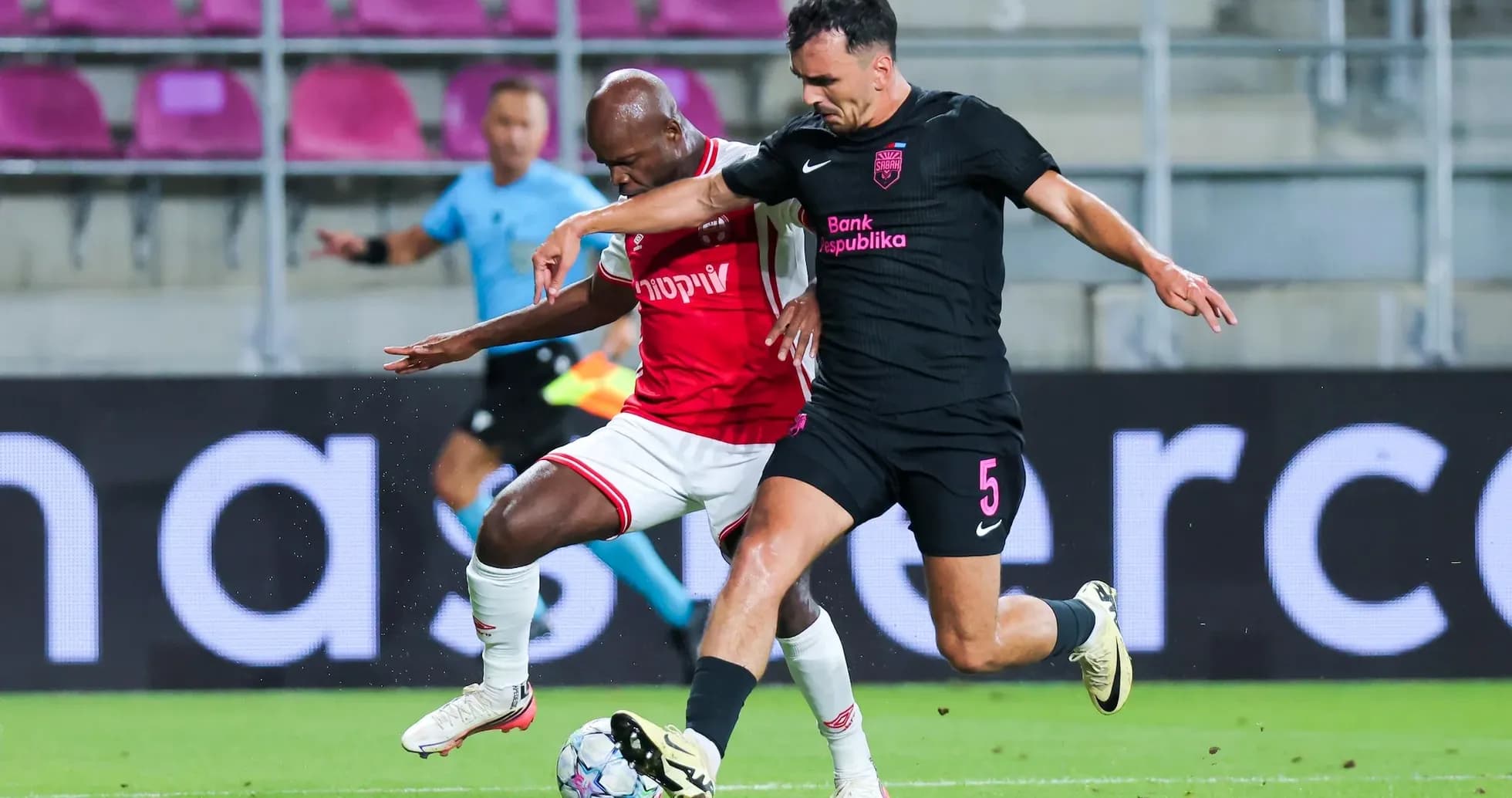 Players contesting for the ball during match