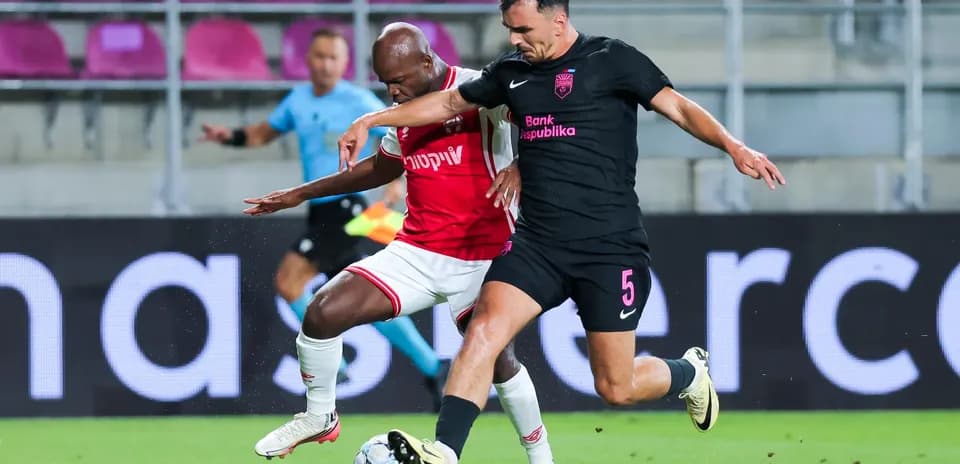 Players contesting for the ball during match