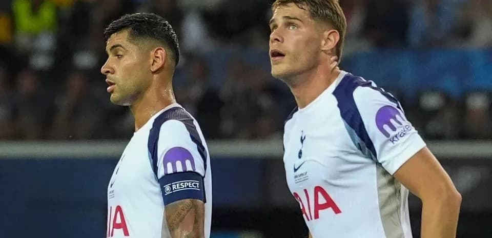 Two Tottenham players looking during a match