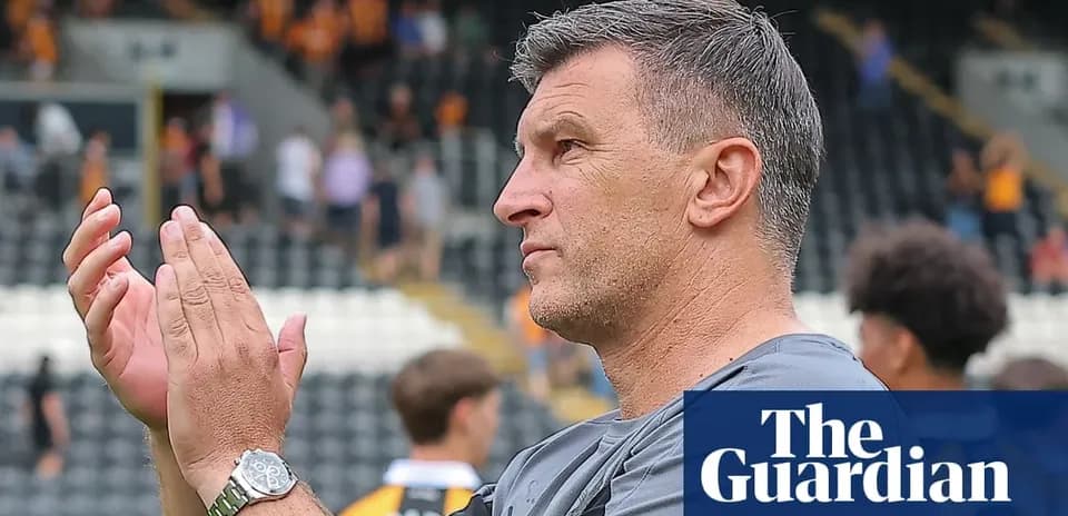 Coach applauding fans after the match