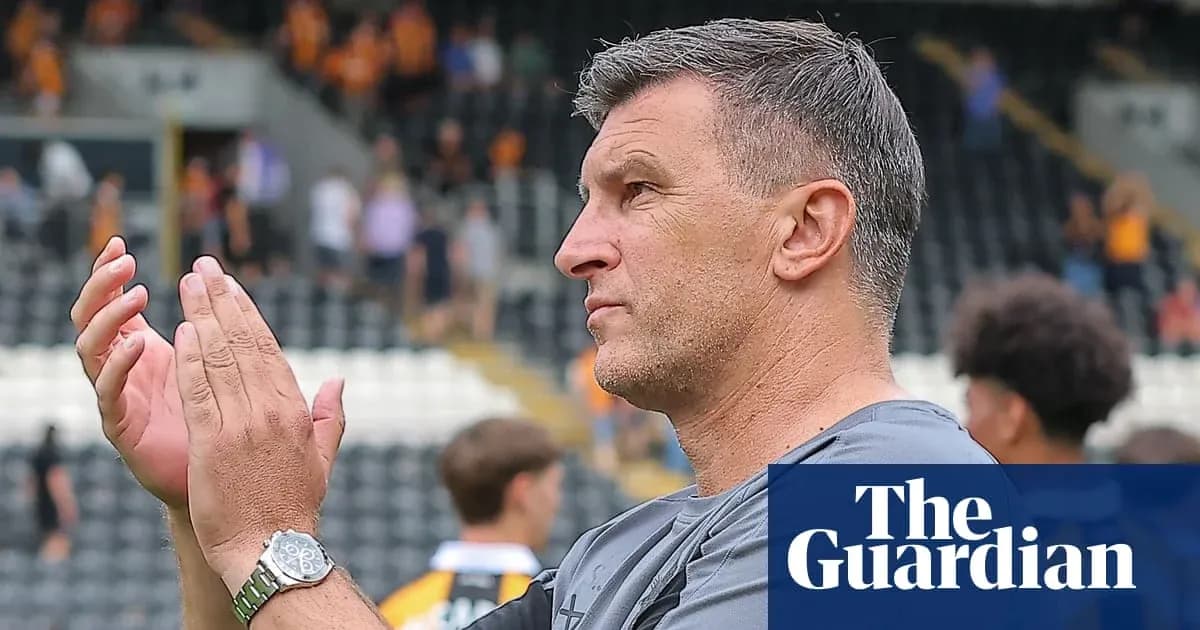 Coach applauding fans after the match
