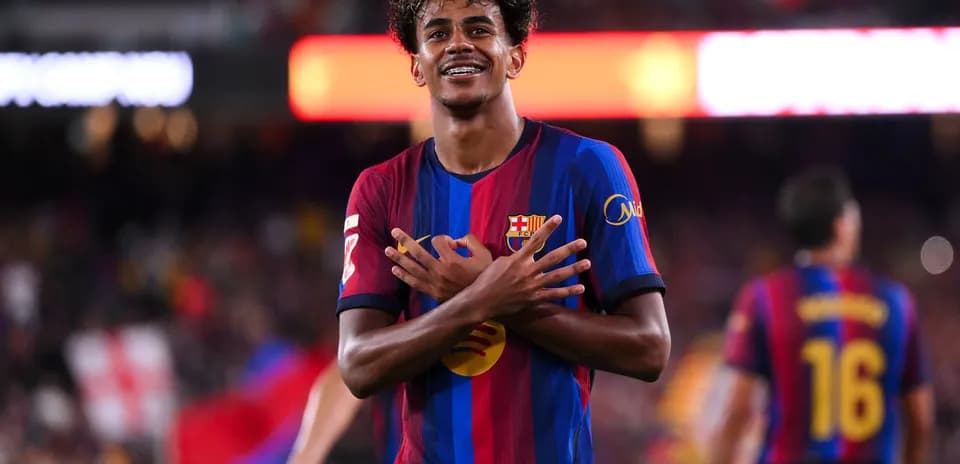 Player celebrating goal with crossed arms gesture
