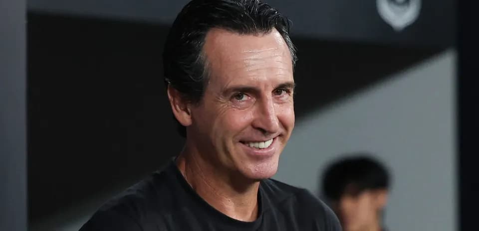 Football manager smiling during match preparations
