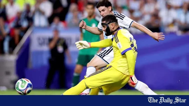 Goalkeeper in yellow kit attempting to save ball