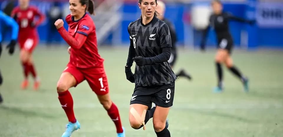 Player in black jersey running during soccer match
