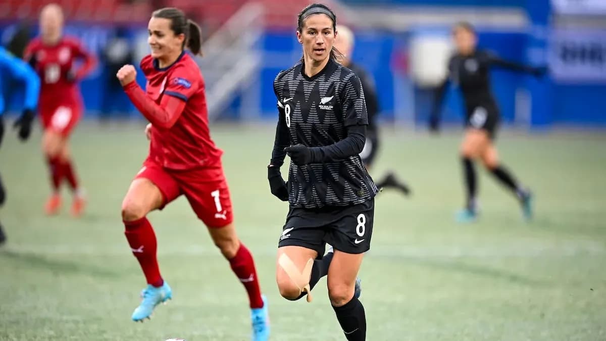 Player in black jersey running during soccer match