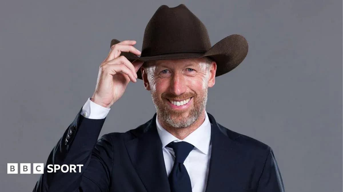 Man in a suit wearing a cowboy hat