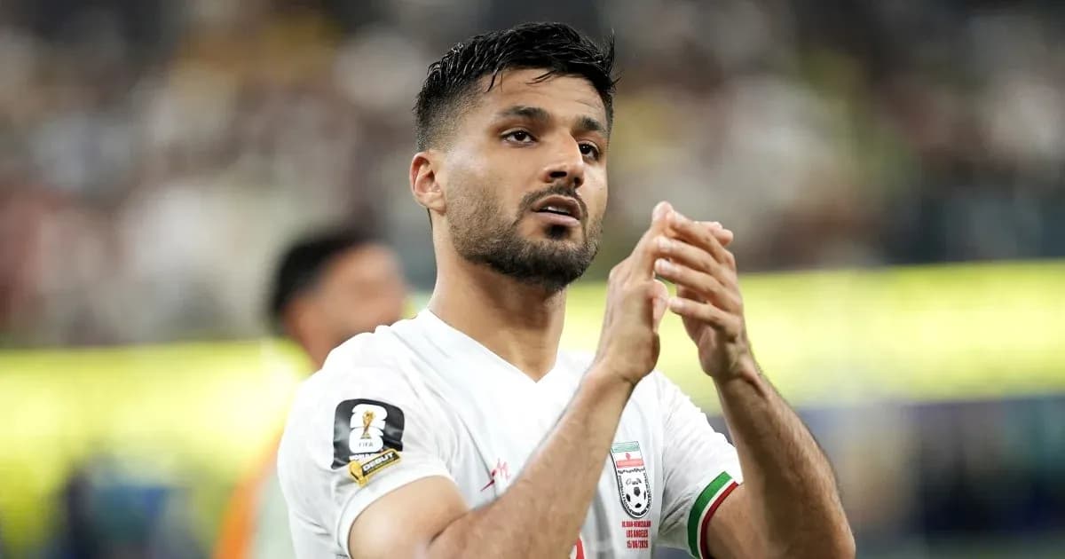 Player applauding fans during a match