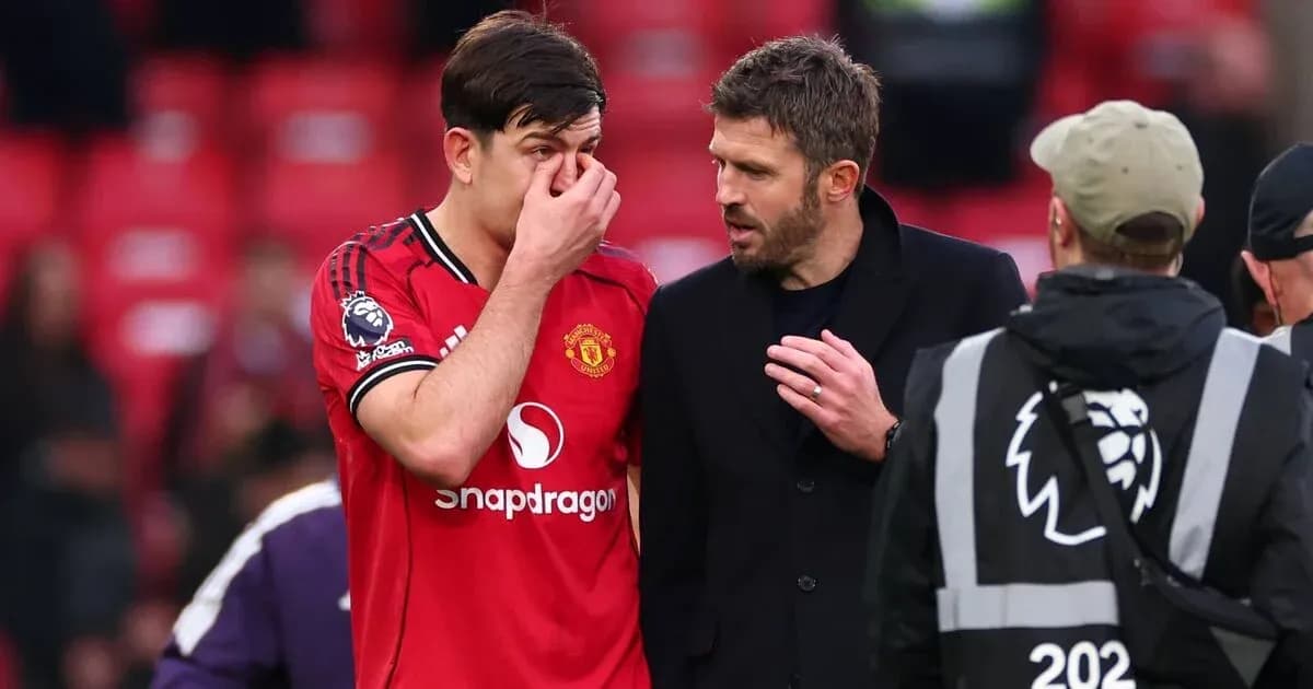 Player discussing with coach after match at stadium