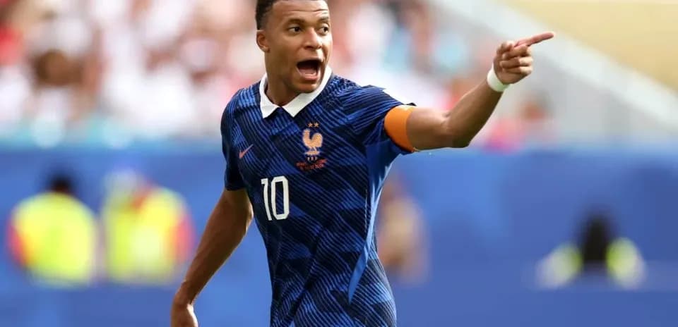 Player gesturing during match wearing France jersey