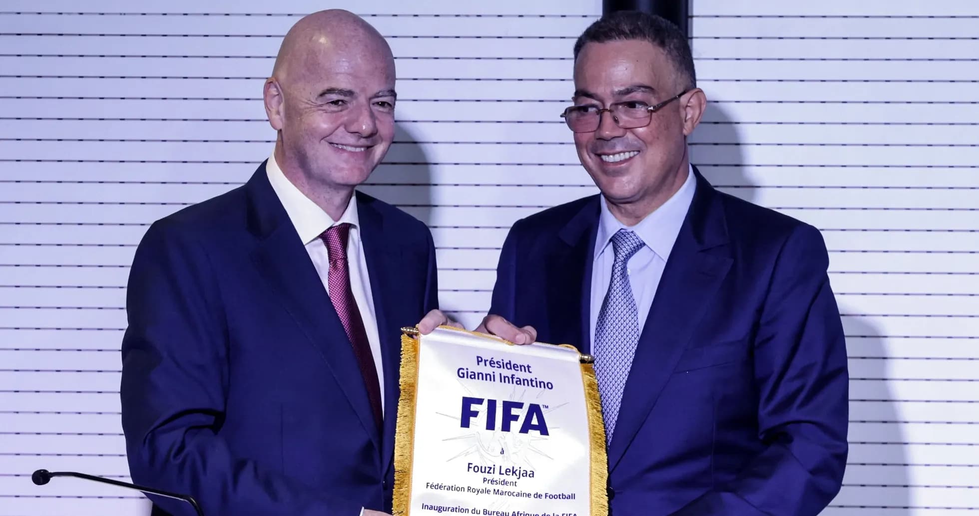 Gianni Infantino presenting plaque to Fouzi Lekjaa