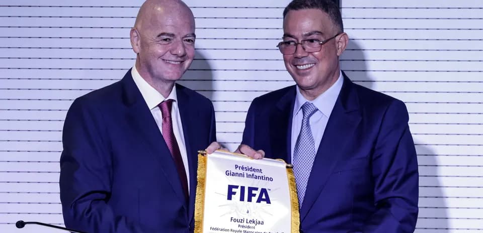 Gianni Infantino presenting plaque to Fouzi Lekjaa