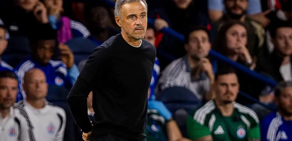 Coach observing from the sidelines during a match