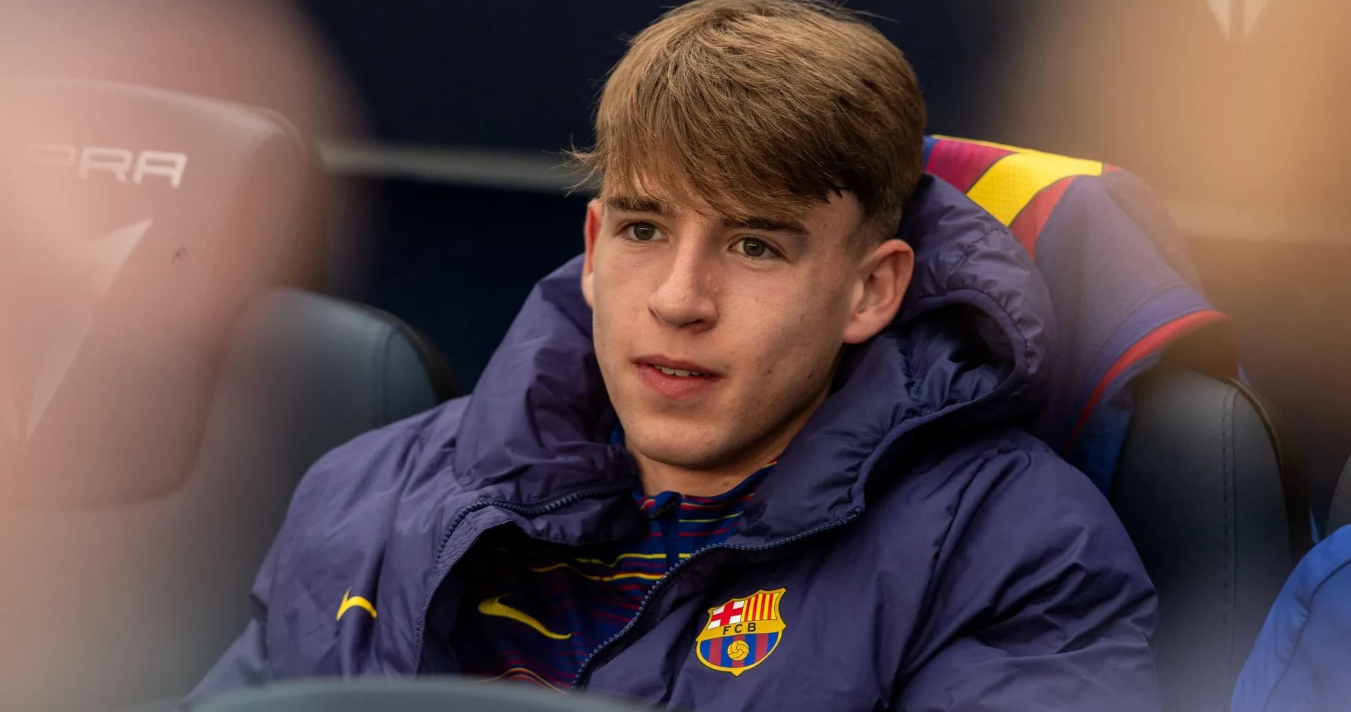 Young player seated on bench during match