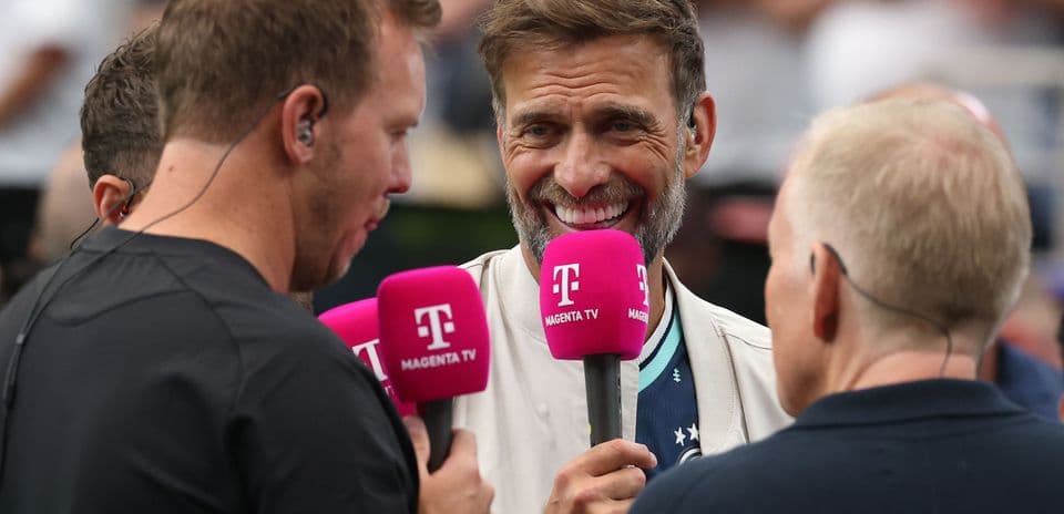 Interview with hosts holding pink microphones