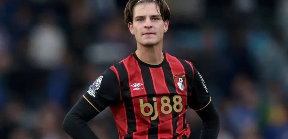 Player in Bournemouth kit on the field