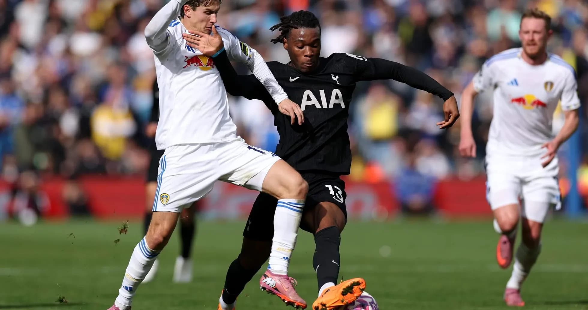 Player tackling during Tottenham vs Leeds match