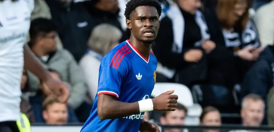 Player in blue kit during football match