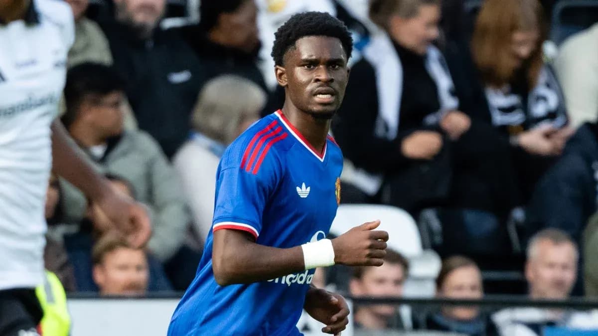 Player in blue kit during football match