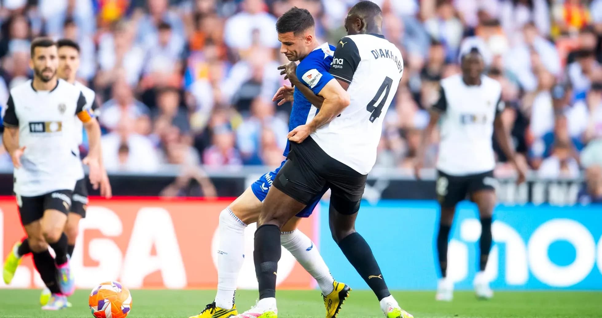 Players contesting for the ball during La Liga match