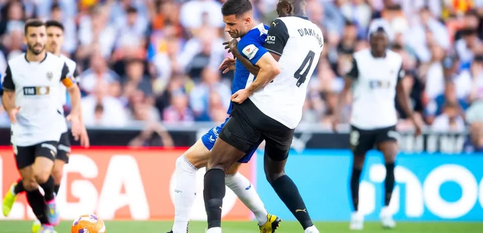 Players contesting for the ball during La Liga match