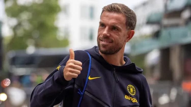 Player giving a thumbs up outside