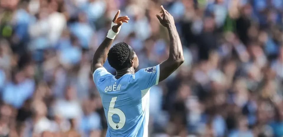 Player celebrating with arms raised during match