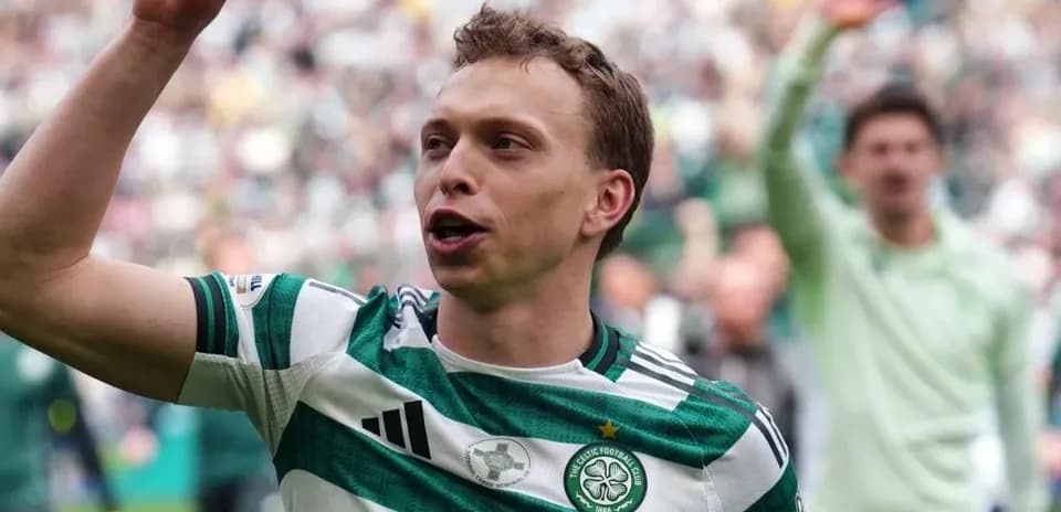 Celtic player celebrating with fans during match