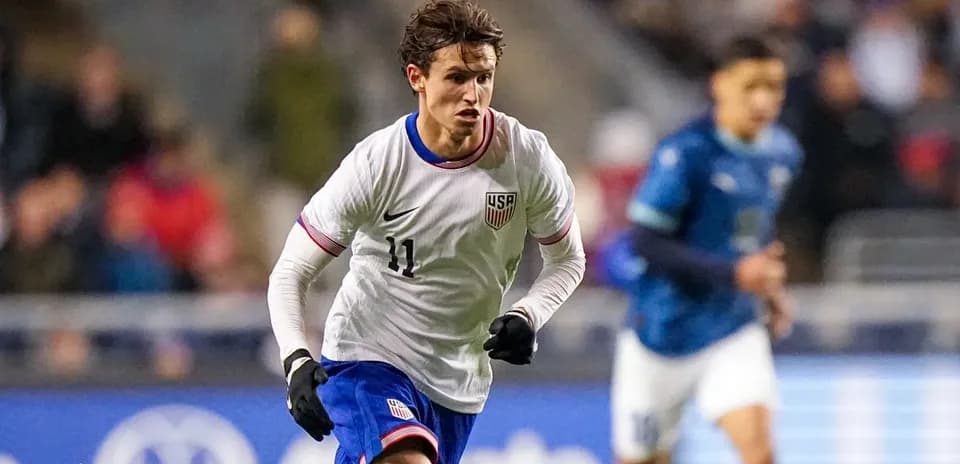 US player dribbling during a soccer match