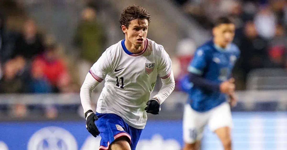 US player dribbling during a soccer match