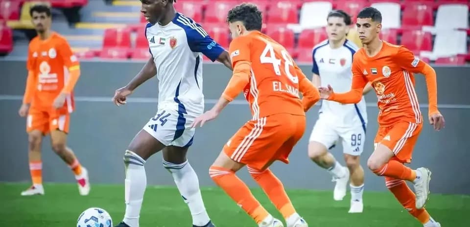 Players competing in U23 football match
