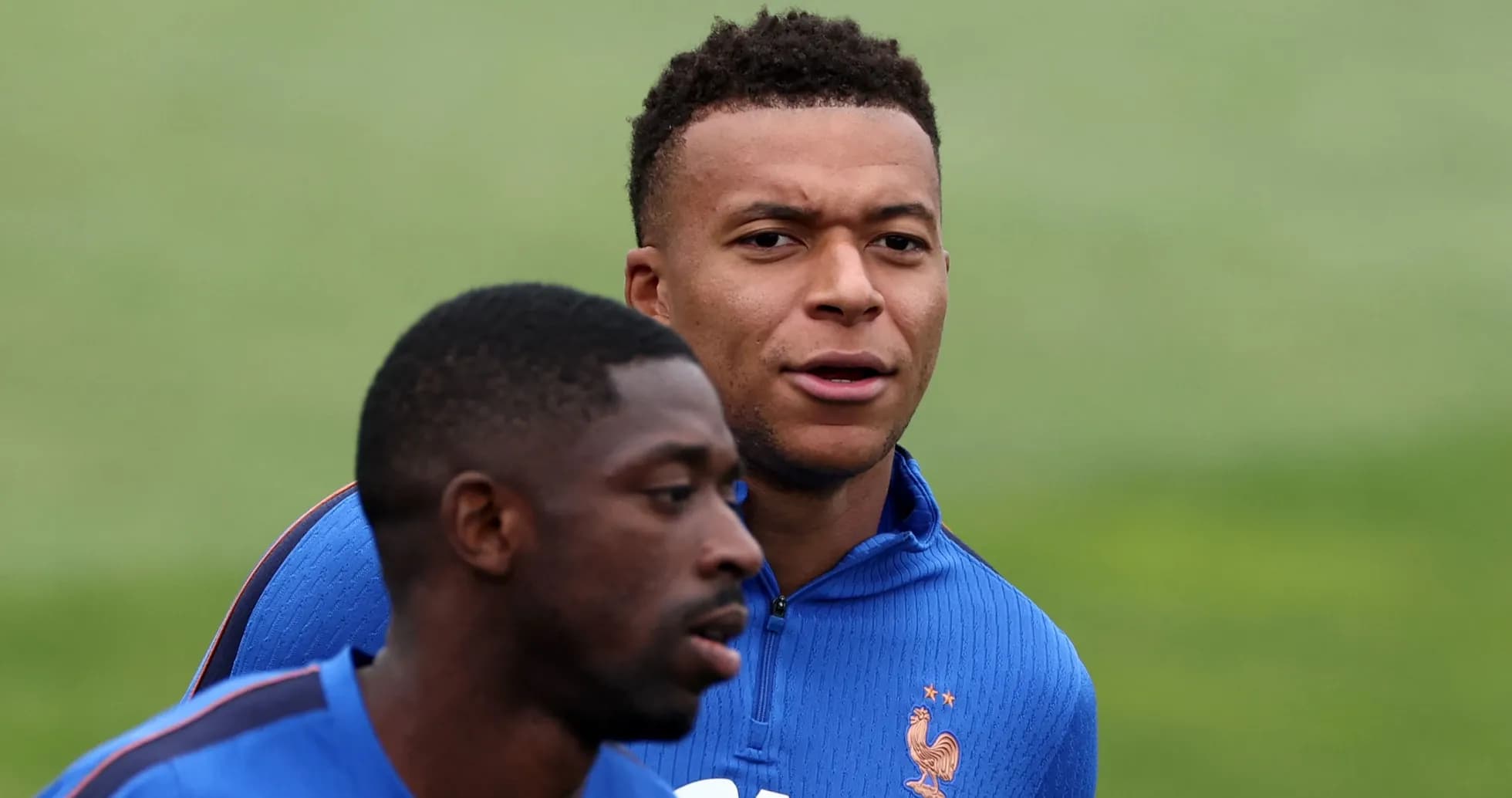 Two players training in blue jerseys at practice