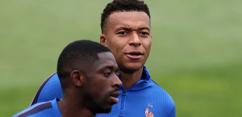 Two players training in blue jerseys at practice