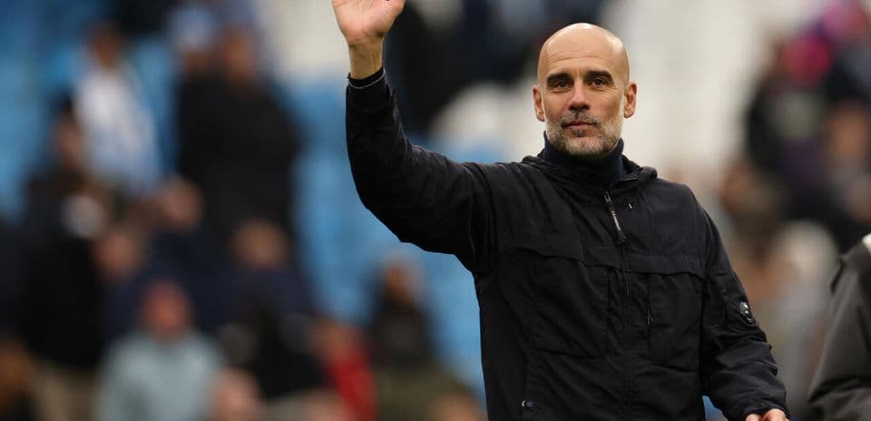 Manager waving to fans during match day