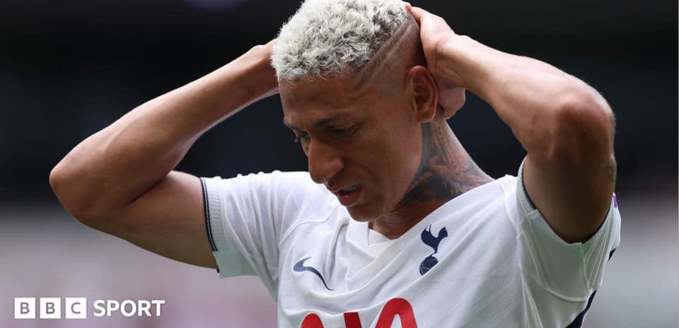 Player holding head in disappointment during match
