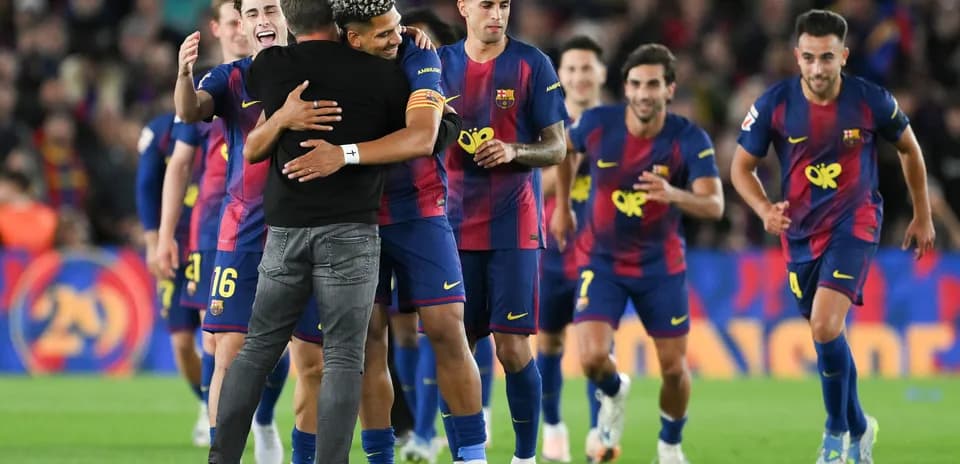 Barcelona players celebrating a victory on the field