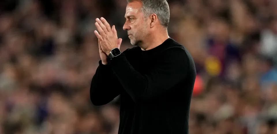 Coach applauding during match at stadium