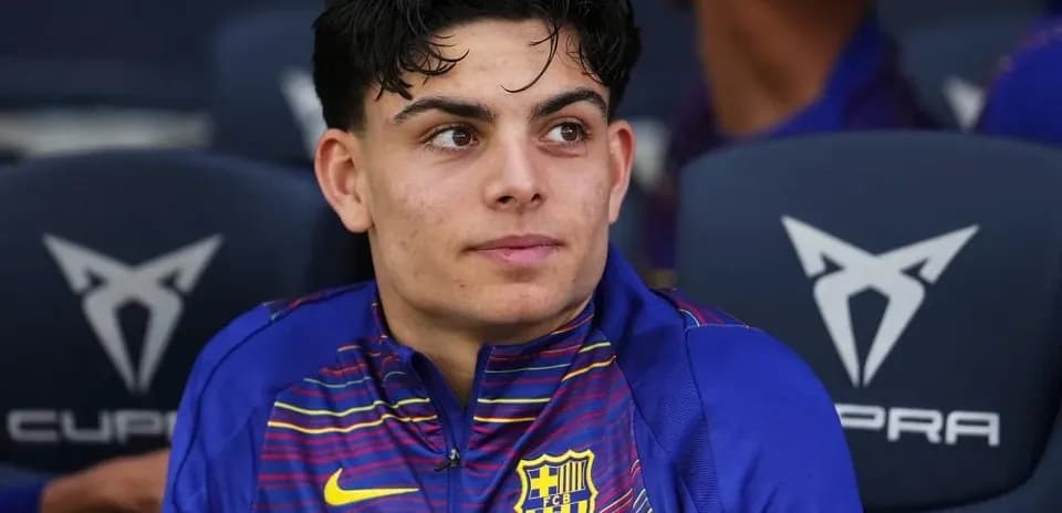 Young player seated on bench during match