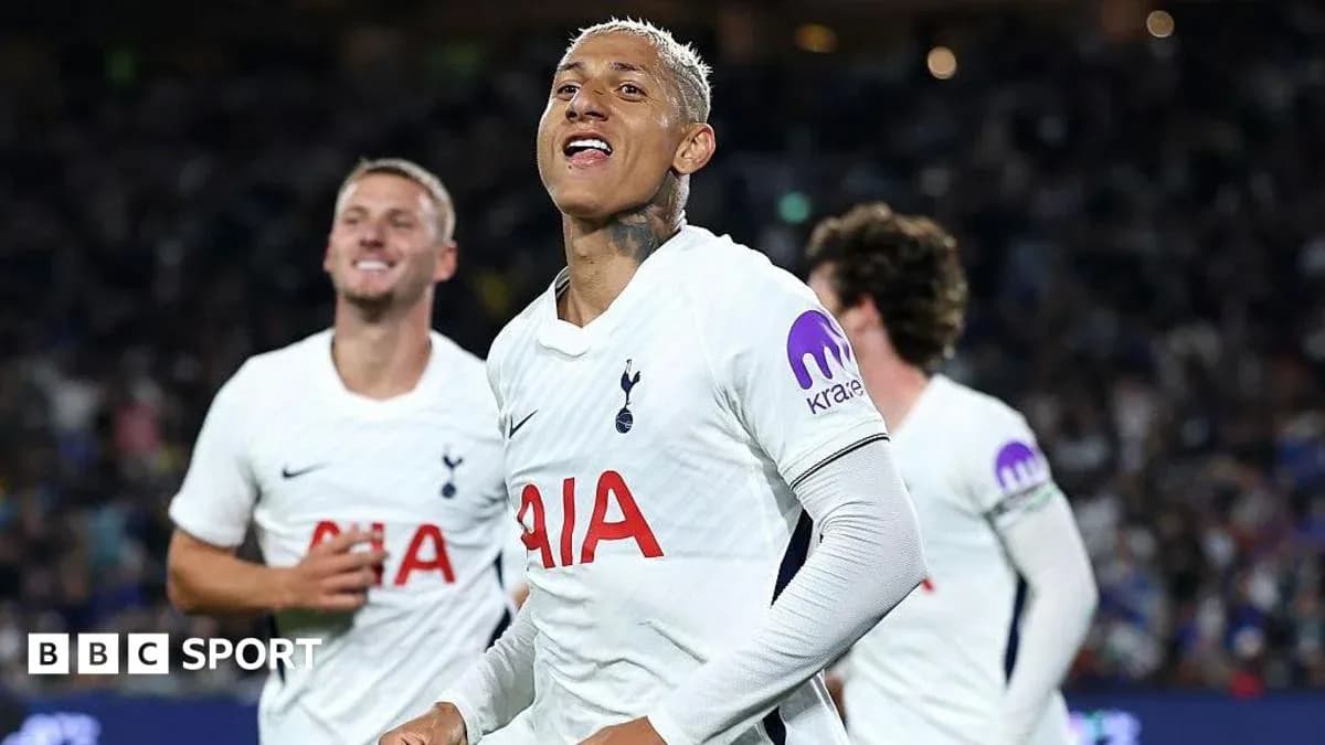 Tottenham players celebrating a goal on the pitch