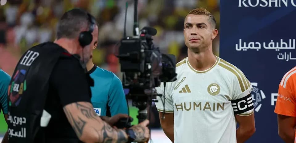 Cristiano Ronaldo standing before a match with camera crew