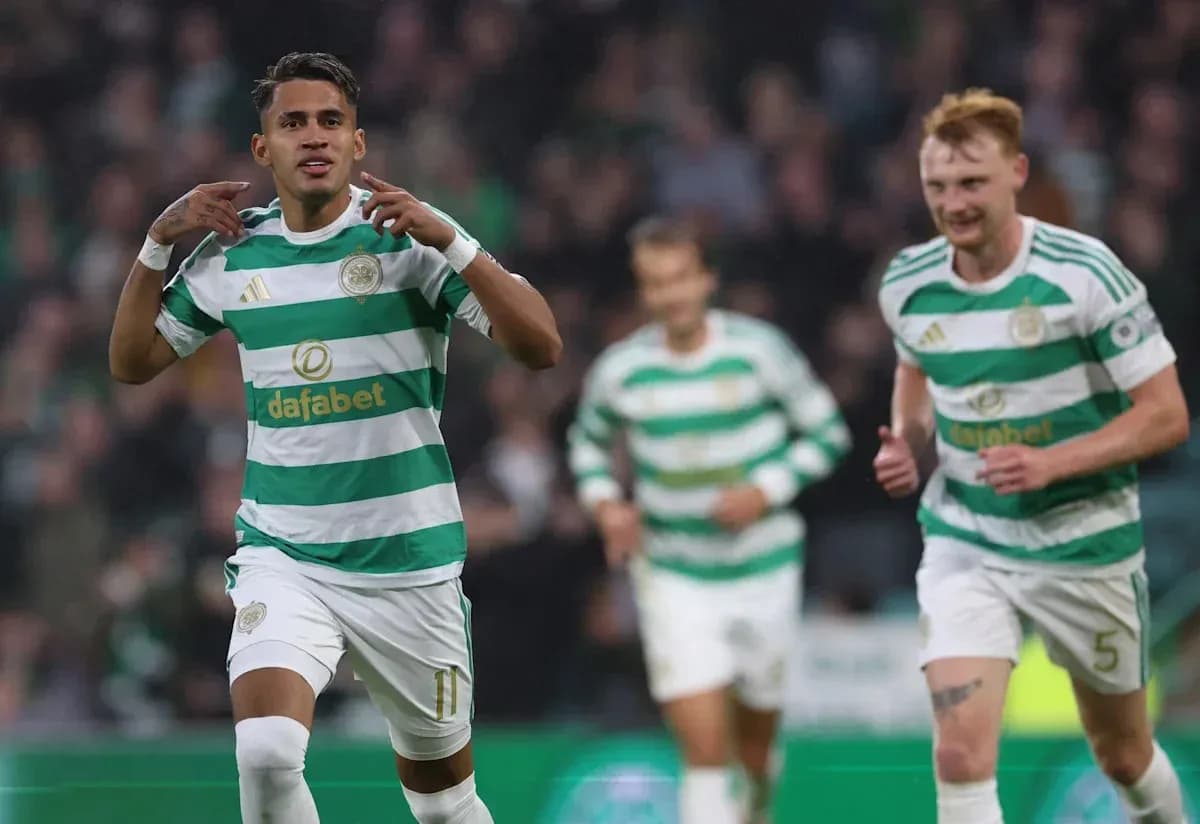 Celtic player celebrating a goal with teammates
