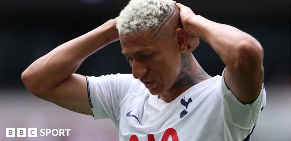 Player holding head in disappointment during match