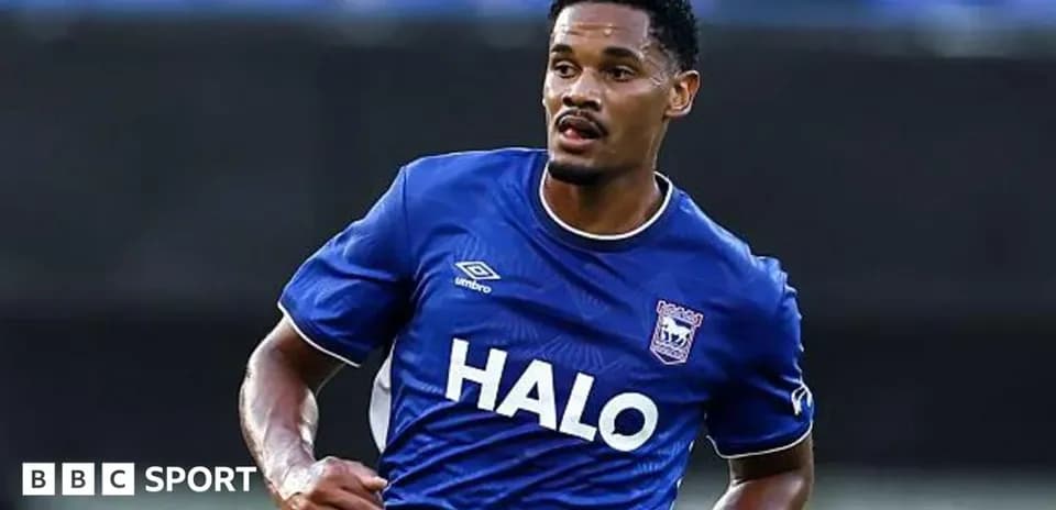 Player running in blue jersey during match