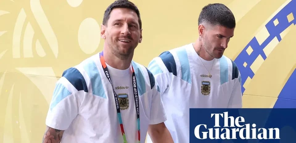 Two players walking with FIFA World Cup credentials