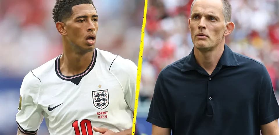 Young player in England jersey and coach on sidelines