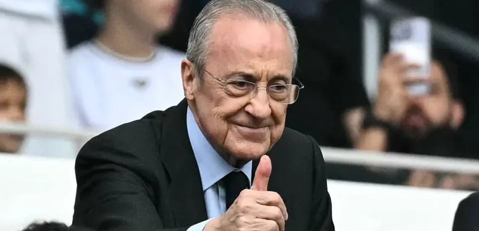 Man giving thumbs up in stadium crowd