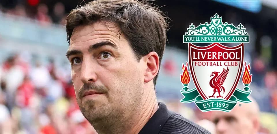 Man observing Liverpool FC logo in background