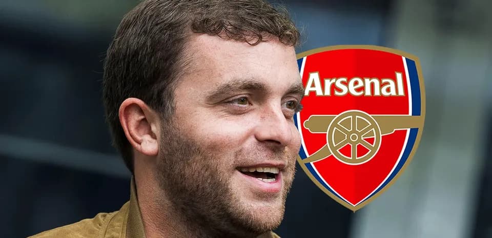 Person smiling with Arsenal logo in background