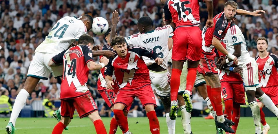 Players contesting a corner kick in La Liga match